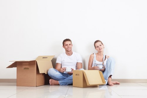 Packed boxes and labelled containers for household storage in Harefield