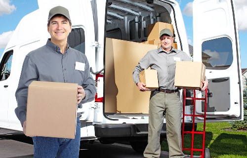 Professional movers handling furniture during a Harefield relocation