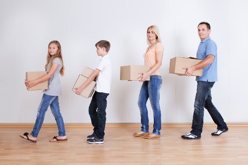 Packed moving boxes and furniture ready for house removals in Harefield